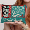 A teal canvas cosmetic bag featuring a vintage sardine print and the word Seasalt