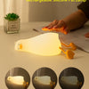 A white silicone duck rechargeable pat lamp illuminating a surface, shown with variations in brightness.
