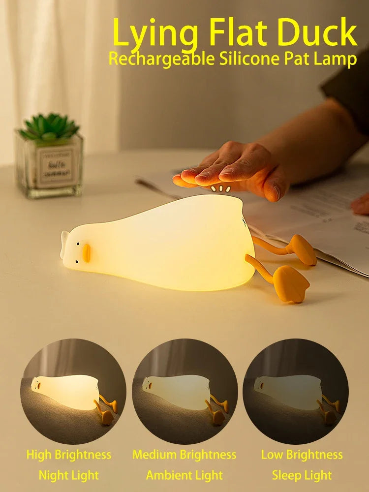 A white silicone duck rechargeable pat lamp illuminating a surface, shown with variations in brightness.