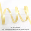 A roll of light yellow chamois satin ribbon shown in a wavy form.