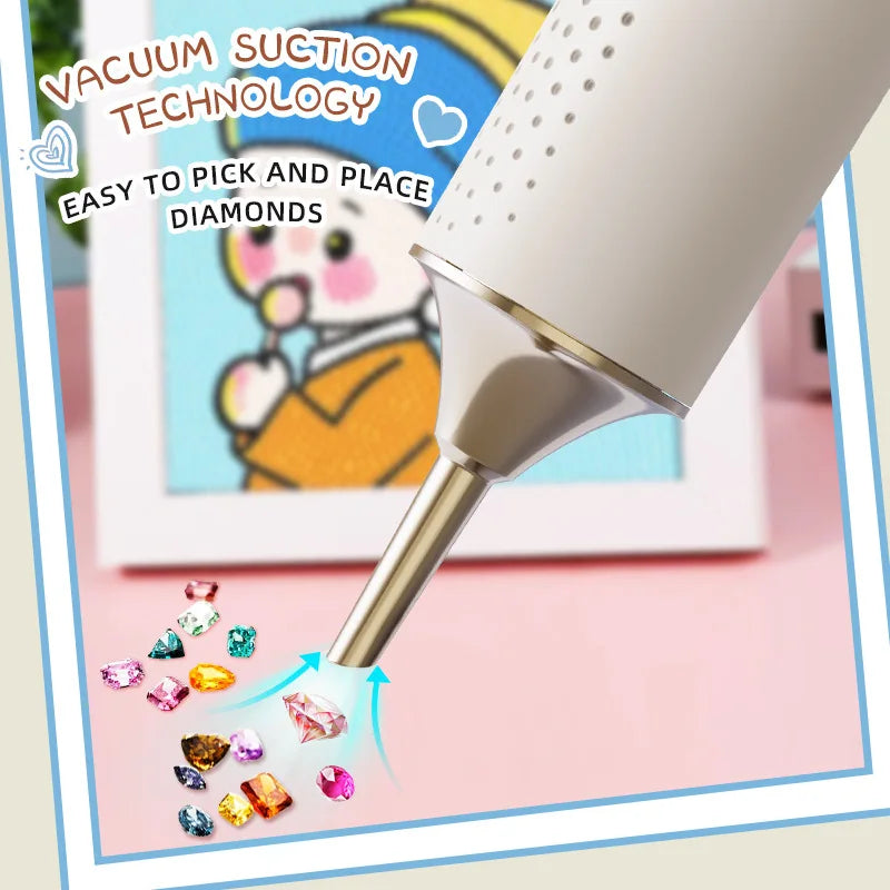 A close-up of a diamond art pen with vacuum suction technology is shown picking up and placing small diamonds on a surface.