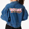 A denim jacket with embroidered text on the back that reads Boujee on a budget