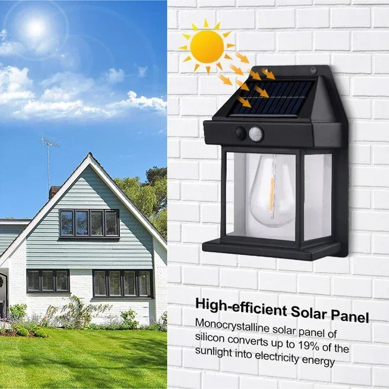 A black solar-powered wall light with a clear glass bulb is mounted on a white brick wall, showing its efficiency.