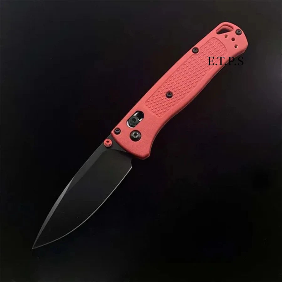 An orange folding pocket knife with a drop point blade shown against a black background.