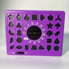 A purple matching puzzle board game with various silhouette shapes for a time challenge activity.