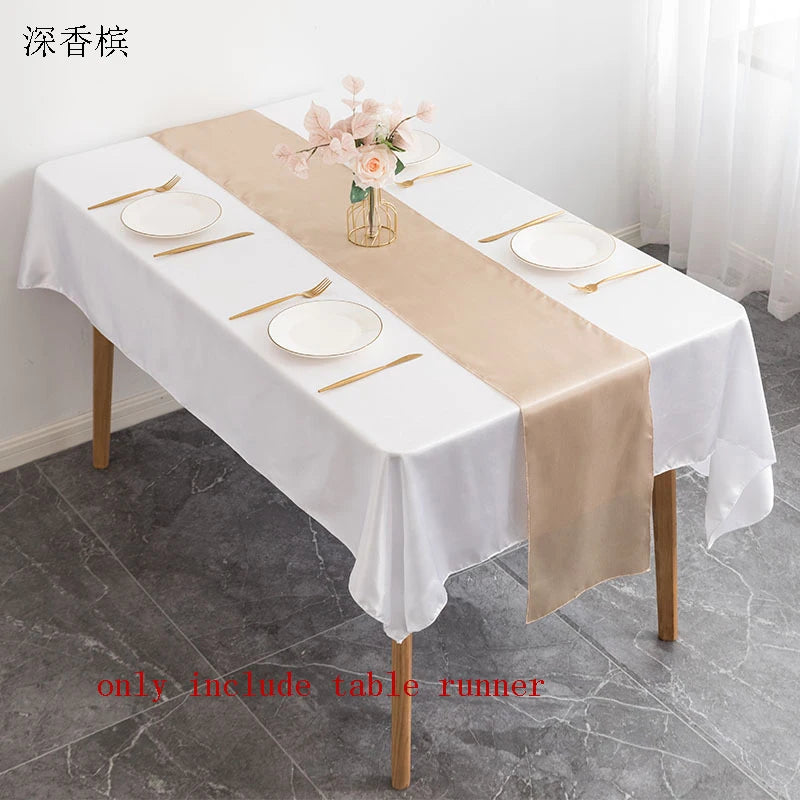 Elegant satin beige table runner displayed on a white tablecloth for events.
