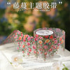 Roll of pink and orange floral vine pattern PET tape used for decorating journals and crafts