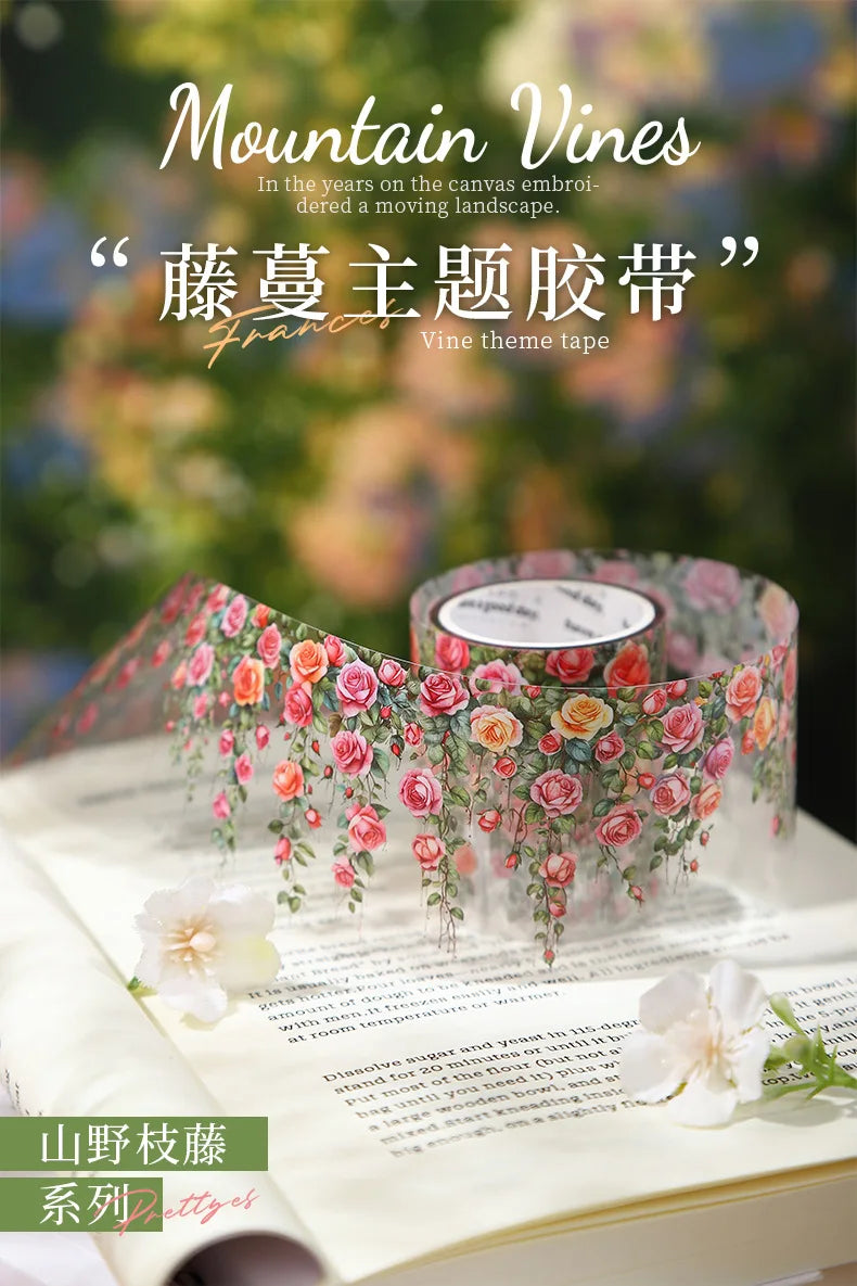 Roll of pink and orange floral vine pattern PET tape used for decorating journals and crafts