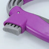A close-up view of a purple ergonomic grocery bag carrier with a soft-grip handle and a textured plastic attachment.