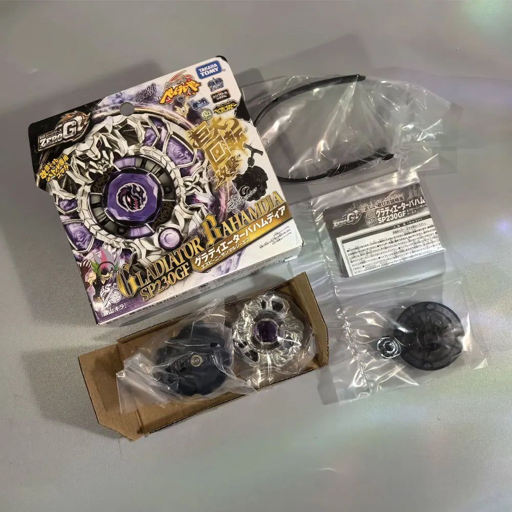 A packaged set of a metal spinning top featuring a purple and gold design, including the top and accessories.