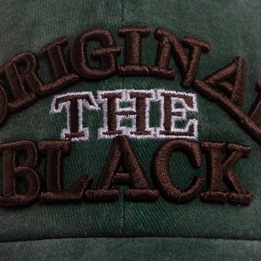 Dark green baseball cap embroidered with the text ORIGIN THE BLACK