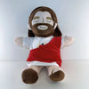 A plush toy of Jesus with a beard and brown hair, featuring a red garment and breathing motion.
