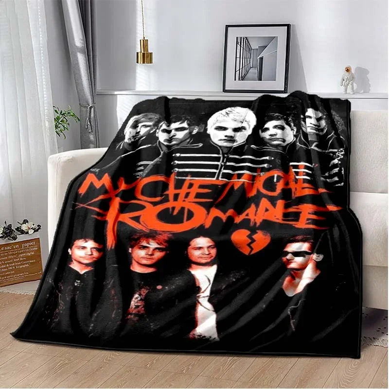A black and white graphic blanket featuring members of the My Chemical Romance band.