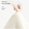 A hand is zooming in on the firm and washable white, bow-shaped absorbent non-slip doormat.