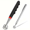A silver telescopic magnet pickup tool with a black handle and red accent, shown against a white background.