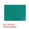 A green 9Sea cutting mat with a grid and ruler markings for sewing and crafting.