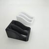 A black double slot wall-mounted wrench organizer rack next to a white version.