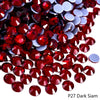 Pile of dark red and silver rhinestones for DIY crafts and clothing decoration
