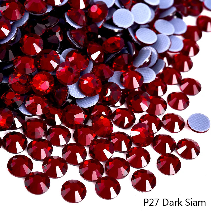 Pile of dark red and silver rhinestones for DIY crafts and clothing decoration