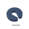 A navy blue foam door stopper with a curved shape designed for finger pinch protection.