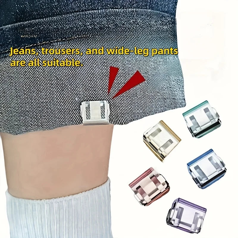 Various clear and colored invisible pant hem clips shown attached to denim jeans.