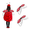 A child wearing a red ladybug wing costume set with black polka dots and white swirls.