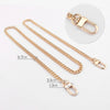 Gold-toned metal purse chain with adjustable buckles and a lobster clasp shown on a white background.