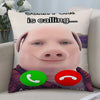 A novelty throw pillow featuring a cartoon pig face with text that reads is calling