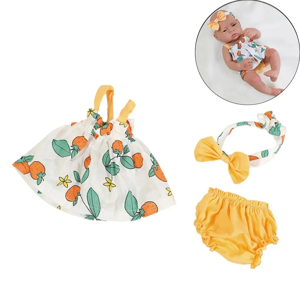 A set of adorable clothing for a baby doll including a floral top, skirt, and yellow bottoms, with a baby in the upper right 