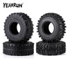 A set of four black monster truck mud terrain rubber tires for RC crawlers.