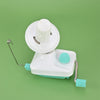 A white hand crank yarn winder device with a green base and a clear plastic spool.