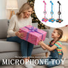 A girl is holding a microphone toy with light effects, sitting on a couch with a gift box nearby.