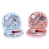 A portable mini sewing kit with pink and light blue compartments for travel and home repairs.