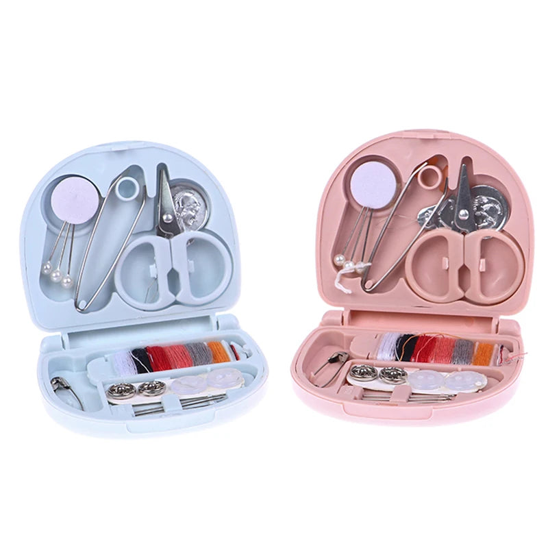 A portable mini sewing kit with pink and light blue compartments for travel and home repairs.