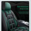 A close-up view of a dark green and black car seat cover featuring a three-dimensional design.
