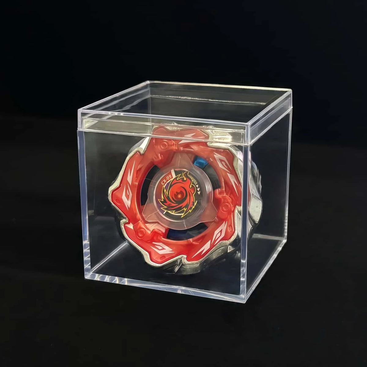 A Valkyrie Volt S4-70V metal spinning top with launcher displayed inside a clear plastic box.