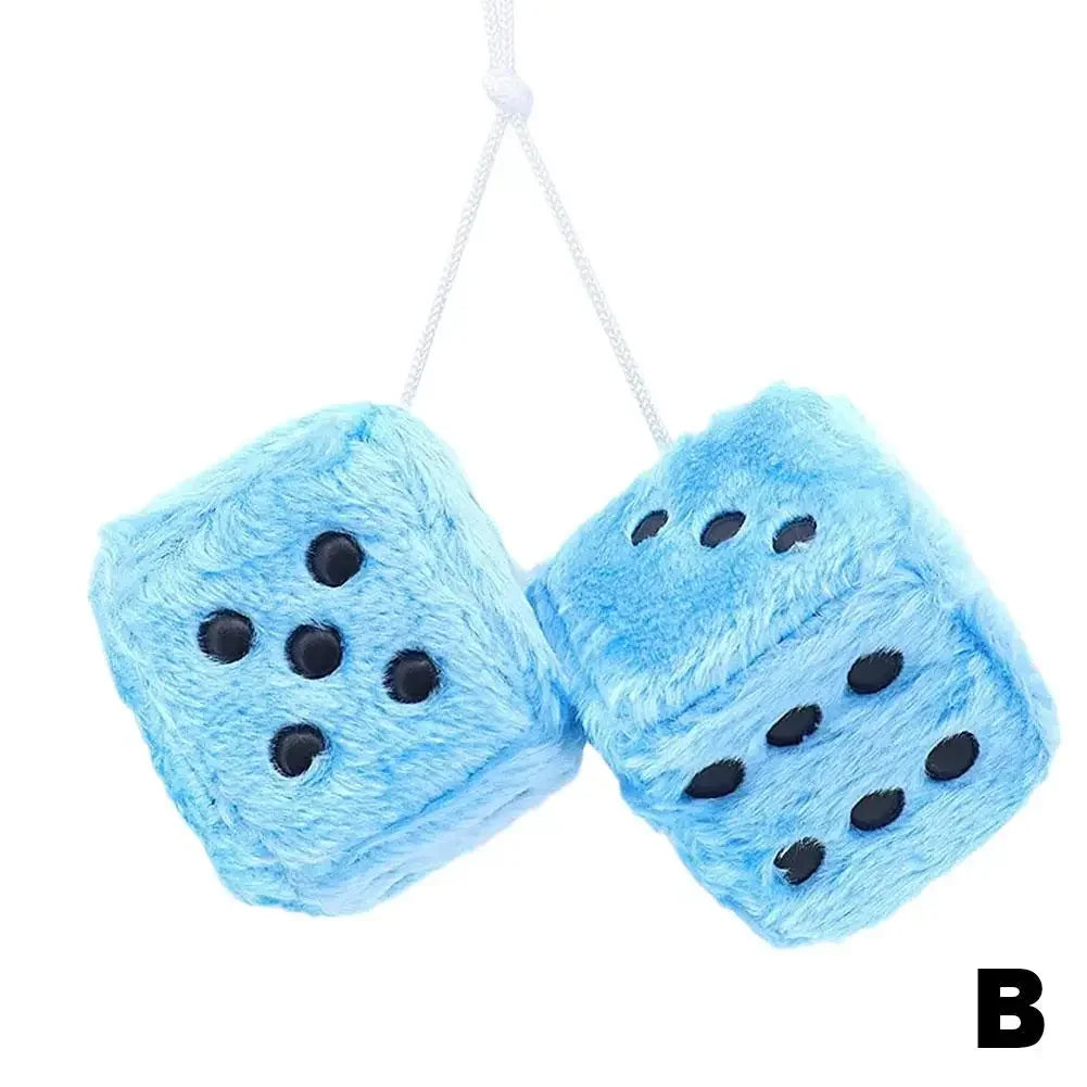 Light blue plush velvet dice with black dots hanging from a white string