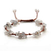 A set of natural crystal chip stones braided into adjustable macrame bracelets for women.