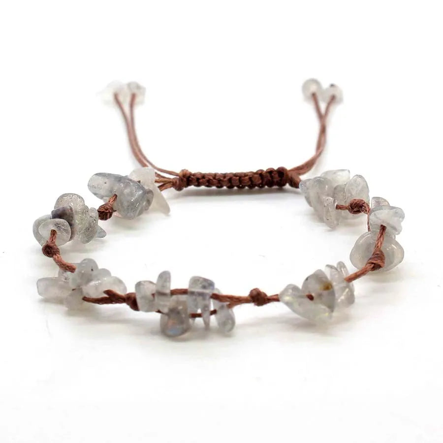 A set of natural crystal chip stones braided into adjustable macrame bracelets for women.