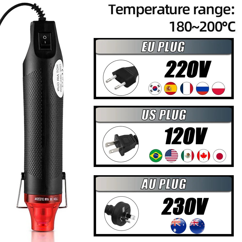 A black heat gun with various plug adapters for EU, US, and AU power sources.