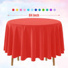 A vibrant red disposable round tablecloth displayed on a wooden table.