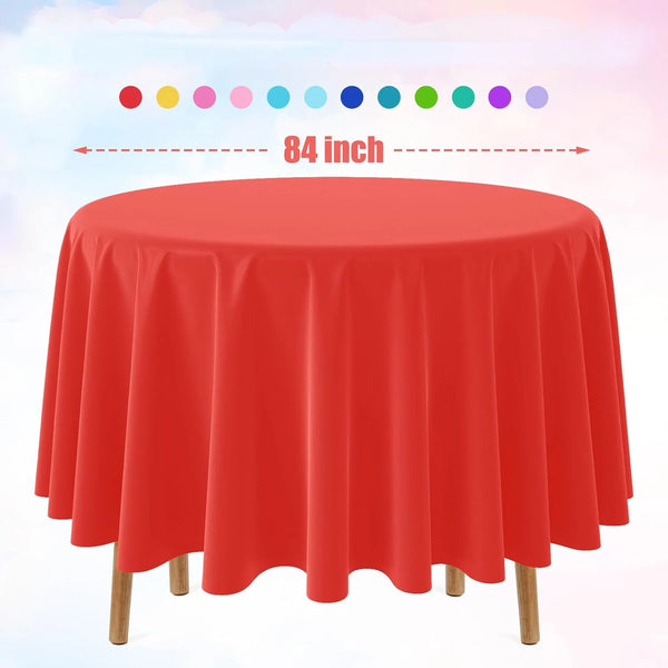 A vibrant red disposable round tablecloth displayed on a wooden table.