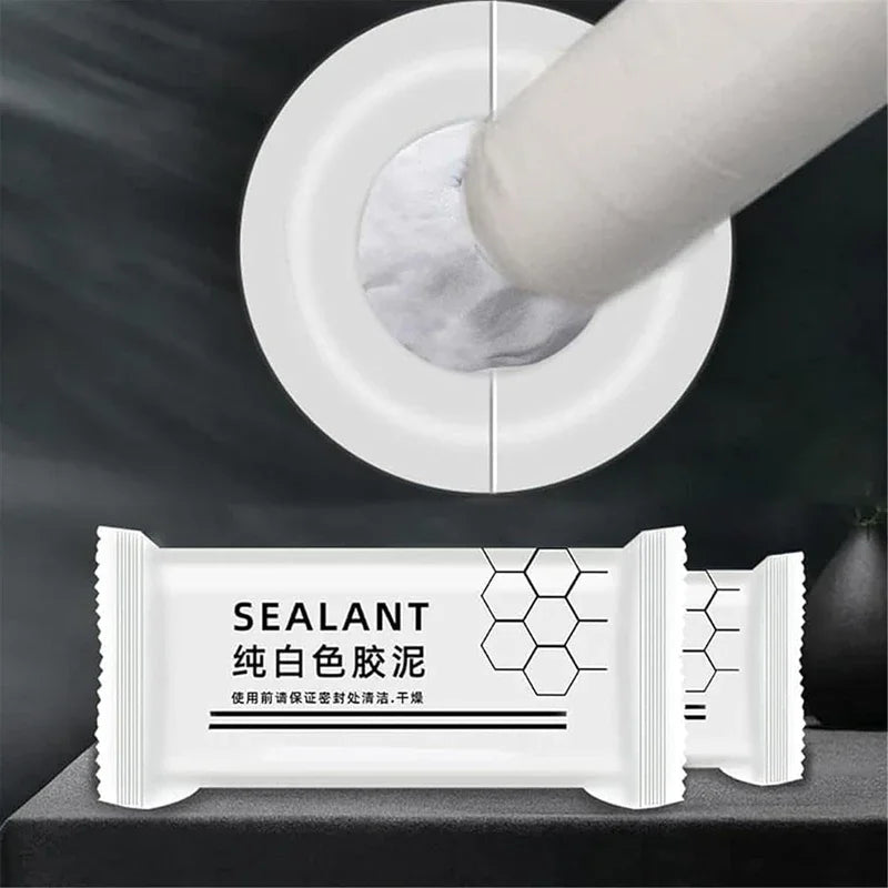 White sealant clay product packaging showing a white tube being applied to a surface.