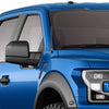 Close-up of a blue truck cab showing an installed universal car radio antenna.