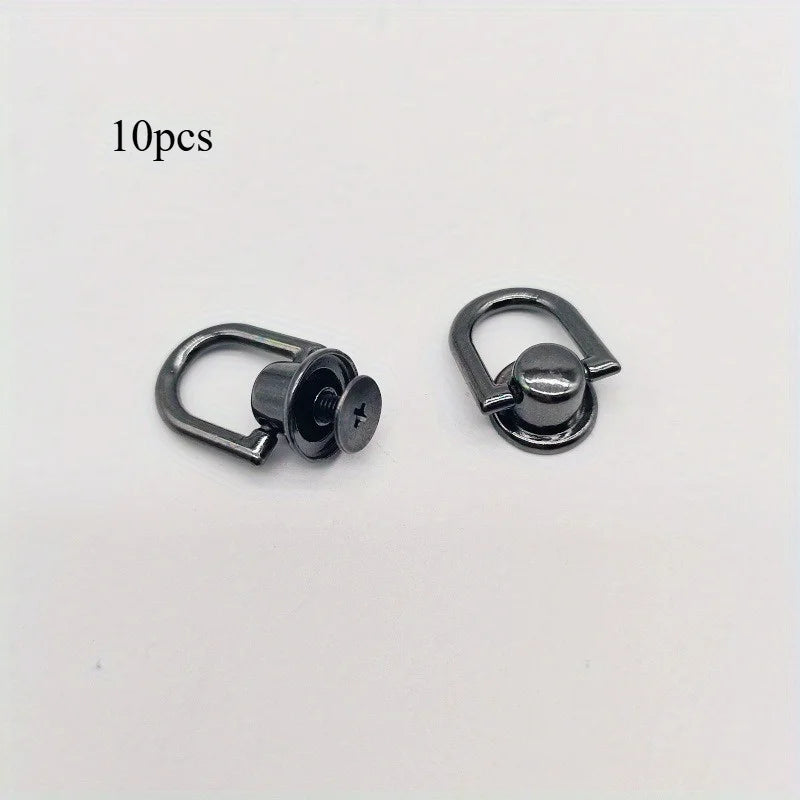 A pair of metal bag and phone case hardware kits with screws shown on a white background.