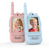 A pair of pink and light blue kids video walkie talkies with HD cameras shown side by side.