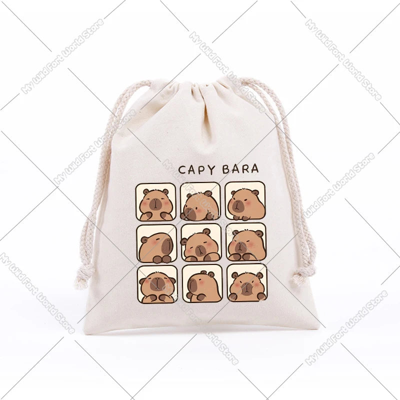 A beige drawstring storage bag featuring multiple cute capybara embroidered patches.
