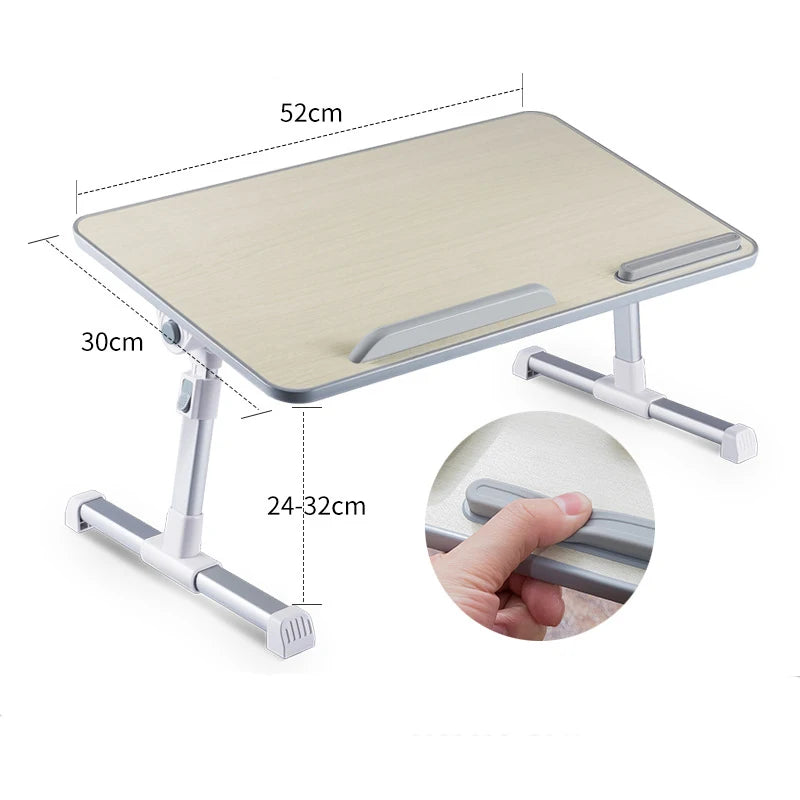 An adjustable foldable laptop desk with a light wood-colored surface and silver metal frame.