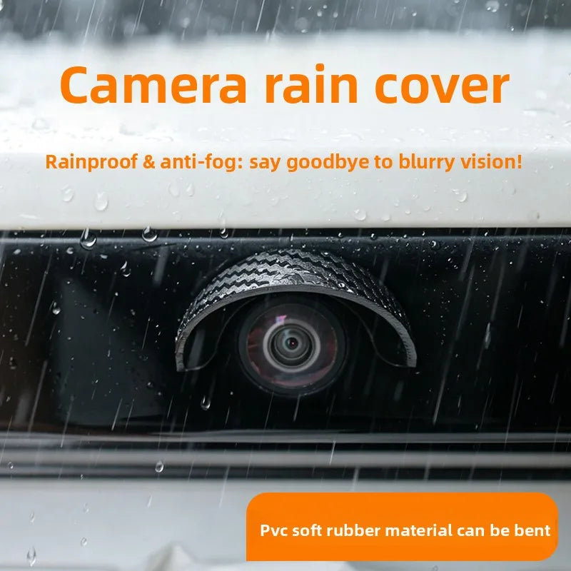 A close-up of a camera rain cover protecting a car's rear camera lens from rain and fog.
