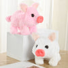A pink and white plush toy pig, featuring an electronic nose, is displayed in a white box.